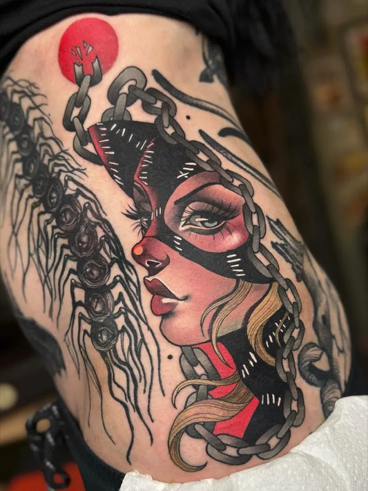 Big Neo Traditional Chained Masked Woman Face on Women Thigh Tattoo by @bethrosetattoo