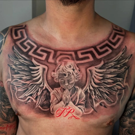 Big Neo Traditional Cherub Angel with Wings and Initials on Men Chest Tattoo by @kit_tattoos