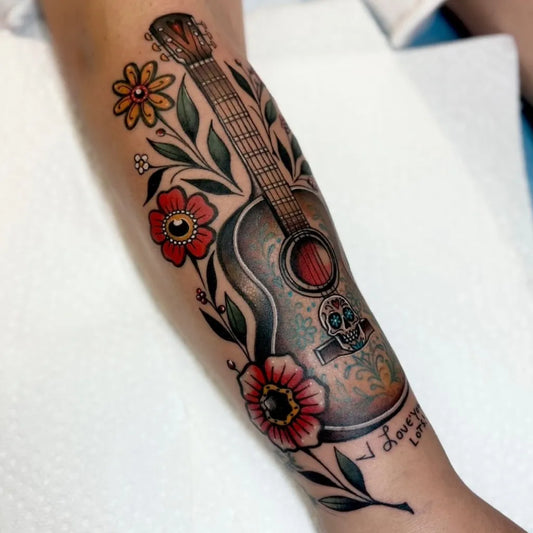 Big Neo Traditional Guitar and Flowers Music Tattoo on Women Arm by @suzieqtattoos