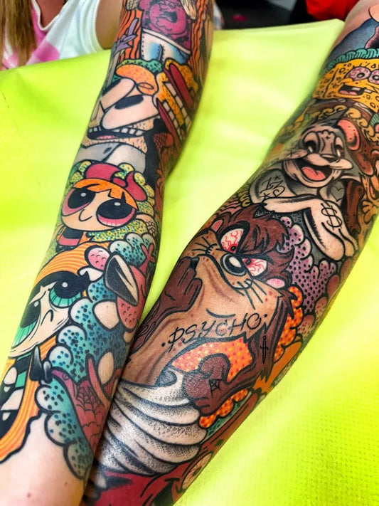 Big Neo Traditional Looney Tunes Characters Cartoon Tattoo on Women Arm by @mikenofcuktattoo
