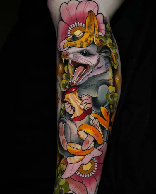 Big Neo Traditional Opossum with Banana and Flowers on Women Thigh Tattoo by @sketchbrooke_