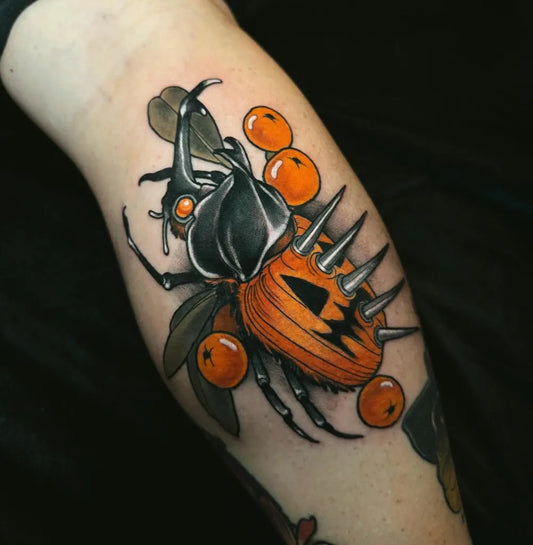 Big Neo Traditional Pumpkin Beetle with Oranges on Women Thigh Tattoo by @shaemotztattoos
