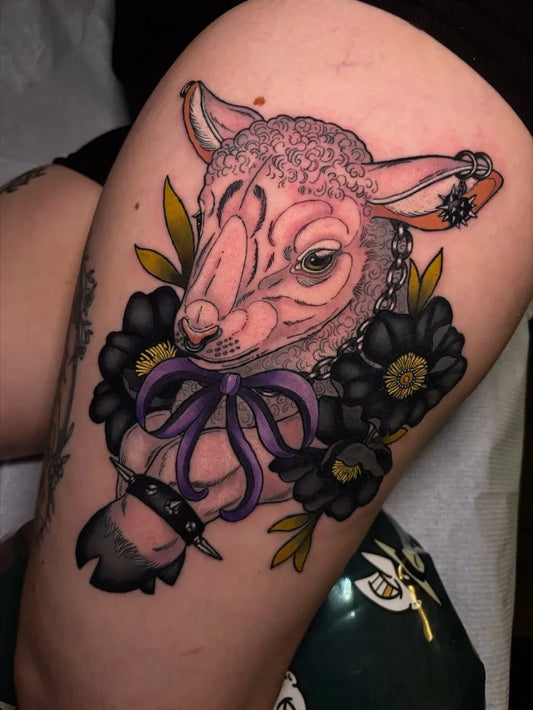 Big Neo Traditional Sheep with Flowers and Bow on Women Thigh Tattoo by @sabrina.addams.tattoos