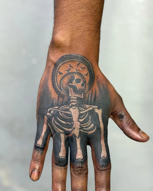 Big Neo Traditional Skull with Halo and Birds on Men Hand Tattoo by @ganeshtattoo23