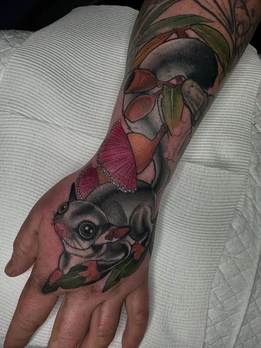 Big Neo Traditional Sugar Glider and Butterfly on Men Arm Tattoo by @lissysirokytattoo