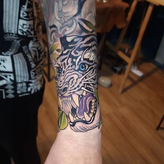 Big Neo Traditional Tiger with Leaves on Men Arm Tattoo by @deeplinetattoo_