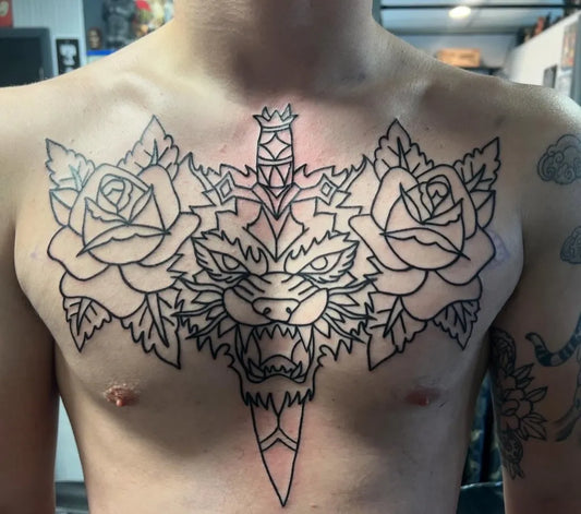 Big Neotraditional Dagger Lion and Roses on Men Chest Tattoo by @kevin.mcdermott.tattoo