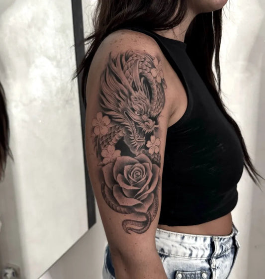 Big Neotraditional Dragon Roses on Women Arm Tattoo by @peppecatalano_tattoo