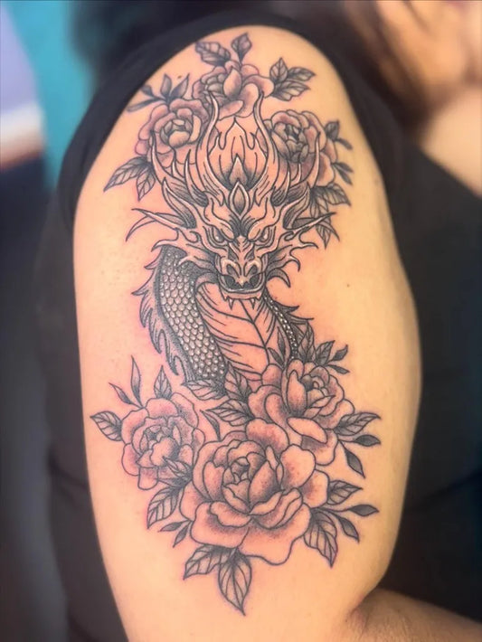 Big Neotraditional Dragon Roses on Women Shoulder Tattoo by @ink.spot.studio