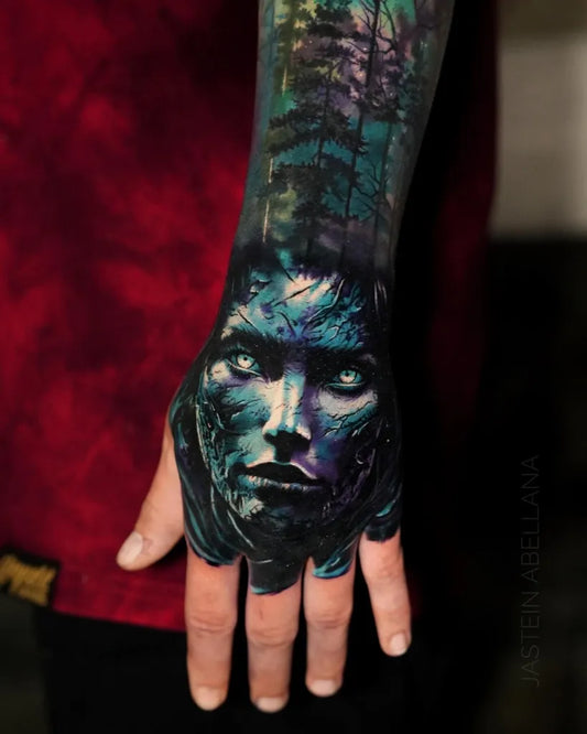 Big Neotraditional Forest Face on Men Hand Tattoo by @jasteinabellana_tattoo
