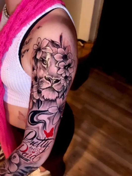 Big Neotraditional Lion and Plumeria Flowers on Women Arm Sleeve Tattoo by @amarii.inks