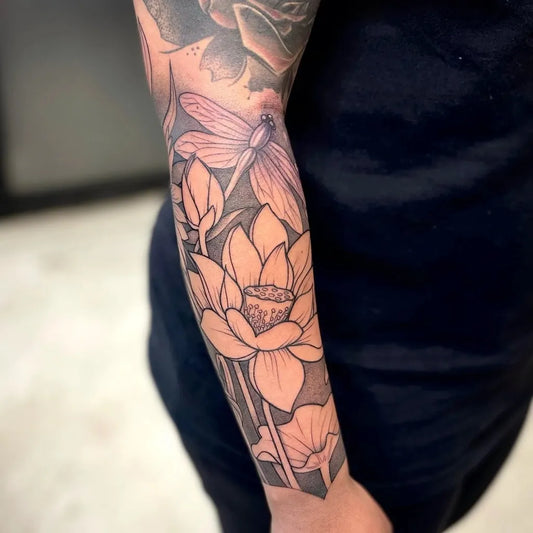Big Neotraditional Lotus and Dragonfly on Women Forearm Tattoo by @pigmentedtattoos