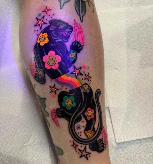 Big Neotraditional Panther with Smiley Flowers Tattoo on Women Leg by @sam.nancy.tattoos