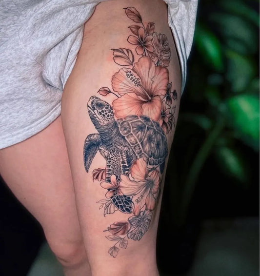 Big Neotraditional Sea Turtle and Hibiscus Flowers on Women Thigh Tattoo by @orphicartcollective_tattoo