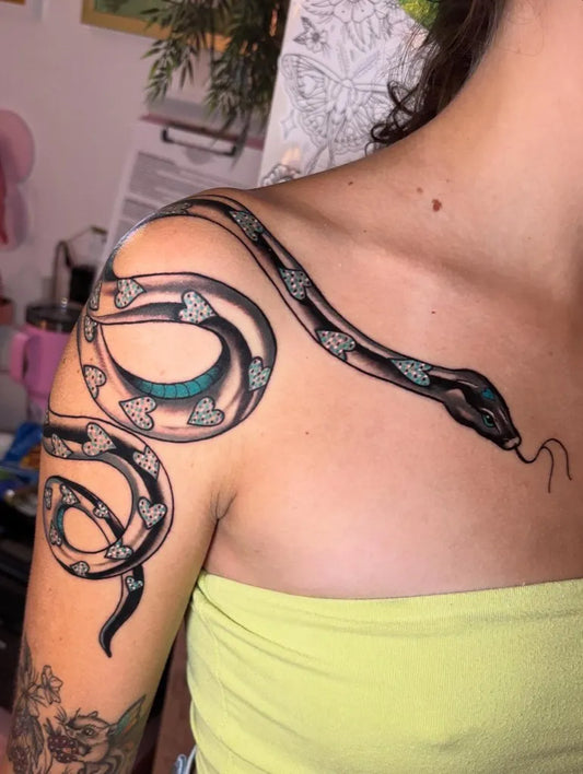 Big Neotraditional Snake with Hearts on Women Shoulder Tattoo by @mandiflooftattoos