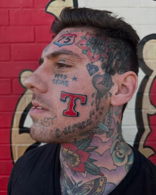 Big Neotraditional TexasLetterHeart on Men Face Tattoo by @mrhalltattooer