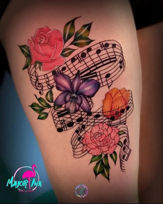 Big New School Flowers and Music Notes Tattoo on Women Thigh by @major_ink_studios