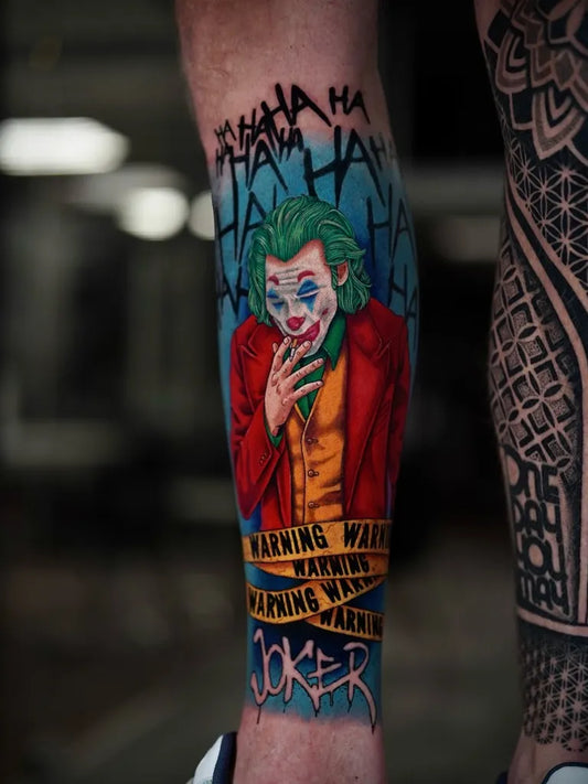 Big New School Joker with caution tape on Men Leg Tattoo by @tyraktattoo