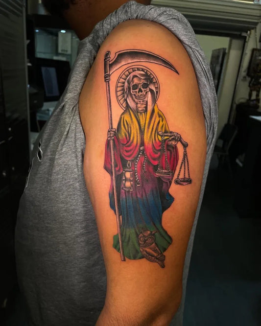 Big New School Santa Muerte with Scythe and Scales Tattoo on Men Upper Arm by @aaron.tattoos