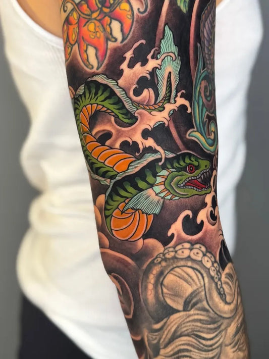 Big New School Snake Octopus Flower Tattoo on Women Arm by @aladdin_sgink
