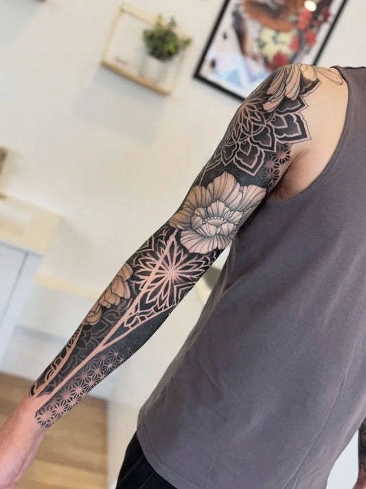 Big Ornamental Mandala Flower Tattoo on Men Arm by @fleur.tattoos