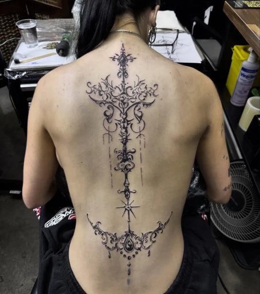 Big Ornate Cross on Women Back Tattoo by @tylerkerrtattoo