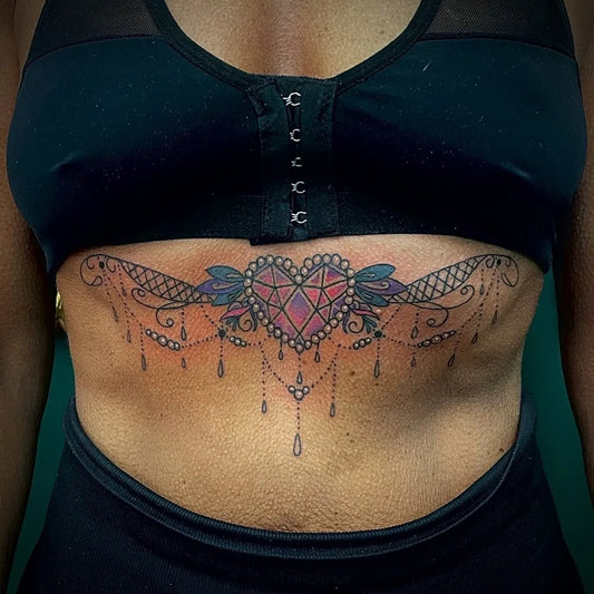 Big Ornate Heart on Women Sternum Tattoo by @humankanvas