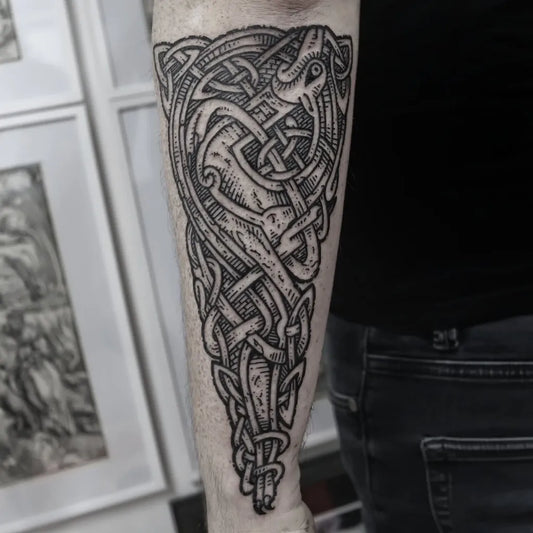 Big Outline Celtic Knot Dragon Tattoo on Men Arm by @joe__murphy__tattoo