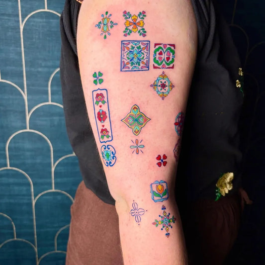 Big Patchwork Geometric Tiles Floral Patterns Symbolic Motifs on Women Arm Tattoo by @maggie.ink.art