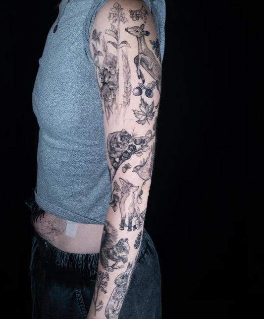 Big Patchwork Giraffe Flowers Plants on Women Arm Tattoo by @inkbybissell