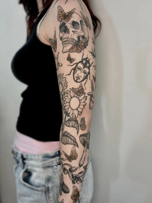 Big Patchwork SkullButterfliesBeetle on Women Arm Tattoo by @culbas