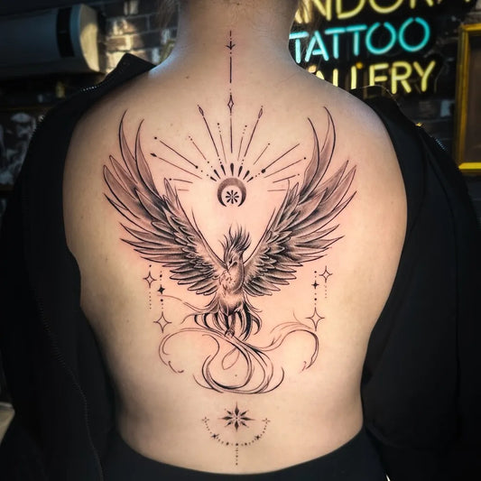 Big Phoenix Wings Sun on Women Back Tattoo by @dogustattoo
