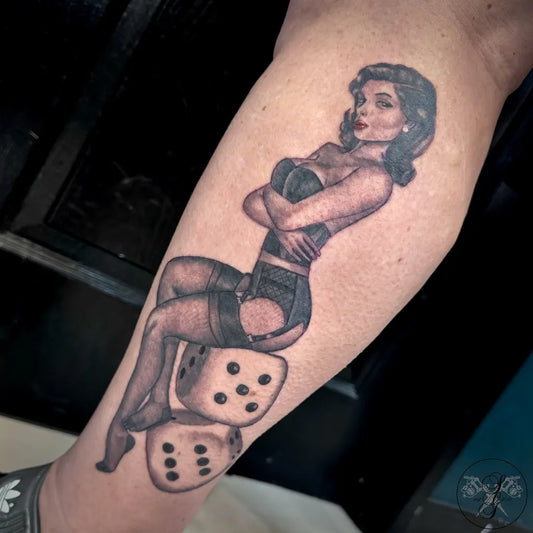 Big Pinup BlackandGrey PinUpGirlWithDice Tattoo on Women Thigh by @blackdaggertattoonorwich