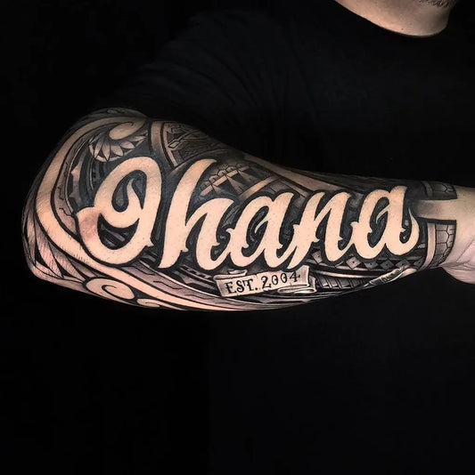 Big Polynesian Ohana text with tribal patterns and established date Tattoo on Men Arm by @lordnugs