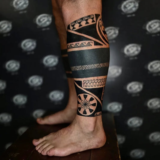 Big Polynesian Tribal Bands and Flowers Tattoo on Men Leg by @charlietatau