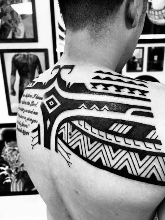 Big Polynesian Tribal Patterns and Text Tattoo on Men Shoulder by @sinkson