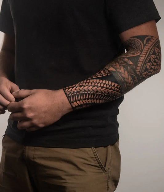 Big Polynesian Tribal Sleeve Tattoo on Men Arm by @skinzophrenictattoos