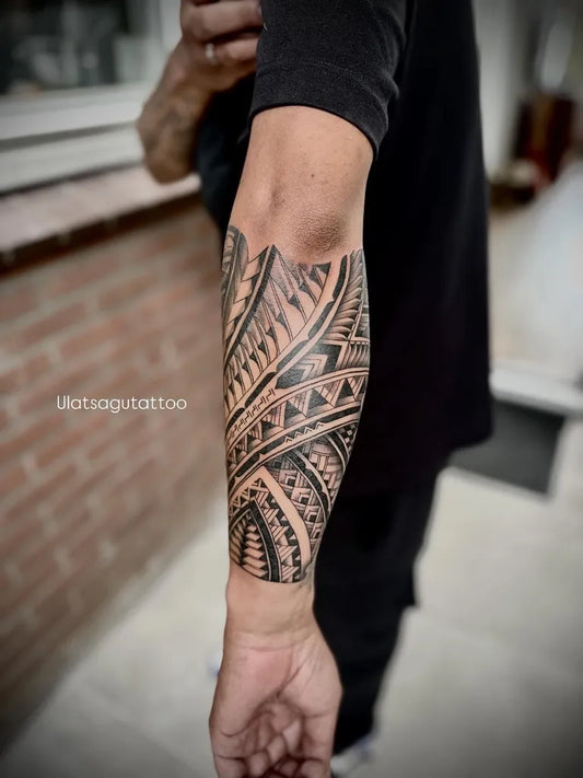 Big Polynesian Tribal Sleeve Tattoo on Men Arm by @ulatsagutattoo