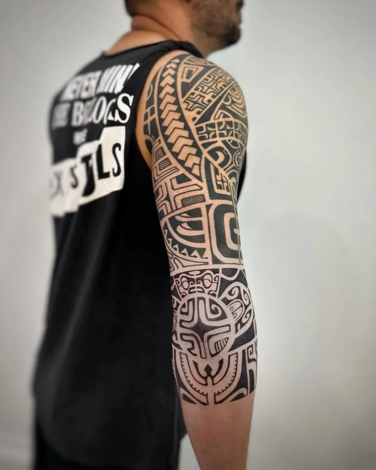 Big Polynesian Tribal Sleeve Tattoo on Men Arm by @vikky_tattoo
