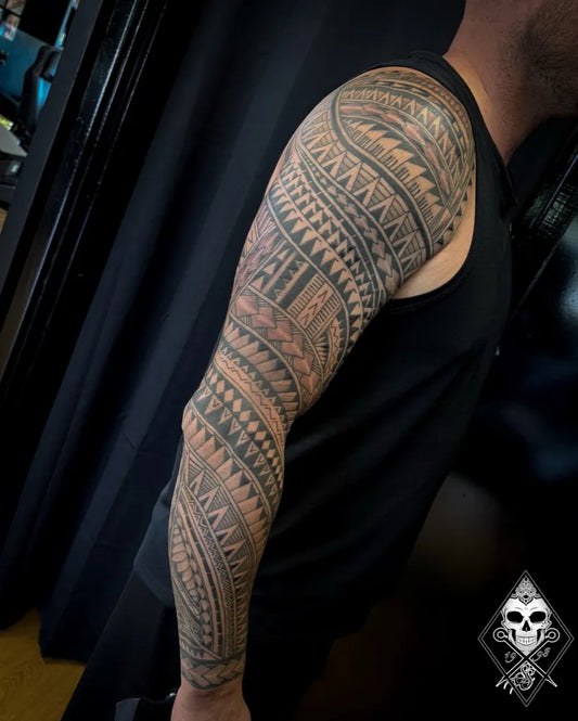 Big Polynesiantribalpatterns on Men Arm Sleeve Tattoo by @blackdaggertattoonorwich