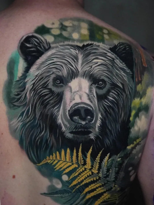 Big Realism Bear with Ferns on Men Shoulder Tattoo by @tolik_gaidamovic