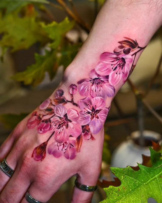 Big Realism Cherry Blossom Flowers on Women Arm Tattoo by @sentimental_laundry