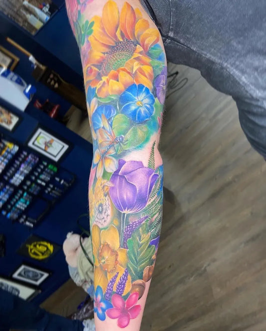Big Realism Floral Bouquet Tattoo on Women Inner Arm by @cal_tattoos