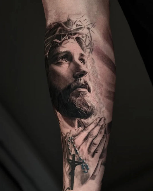 Big Realism Jesus with Crown of Thorns and Praying Hands Tattoo on Men Arm by @kibavu_tattoo