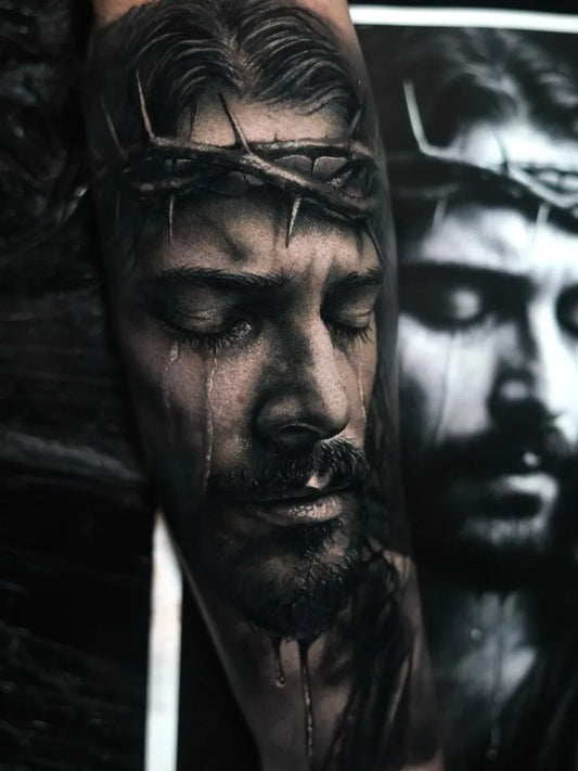 Big Realism Jesus with Thorn Crown and Tears Tattoo on Men Arm by @gianluca_napolitano_tattoo