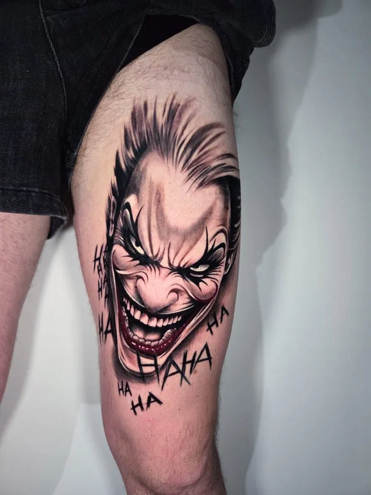 Big Realism Joker on Men Thigh Tattoo by @kristal_ink_tattoo