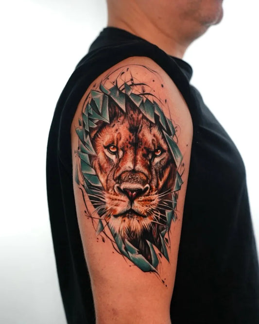 Big Realism Lion with green leaves on Men Arm Tattoo by @yarsugenc.tattoo