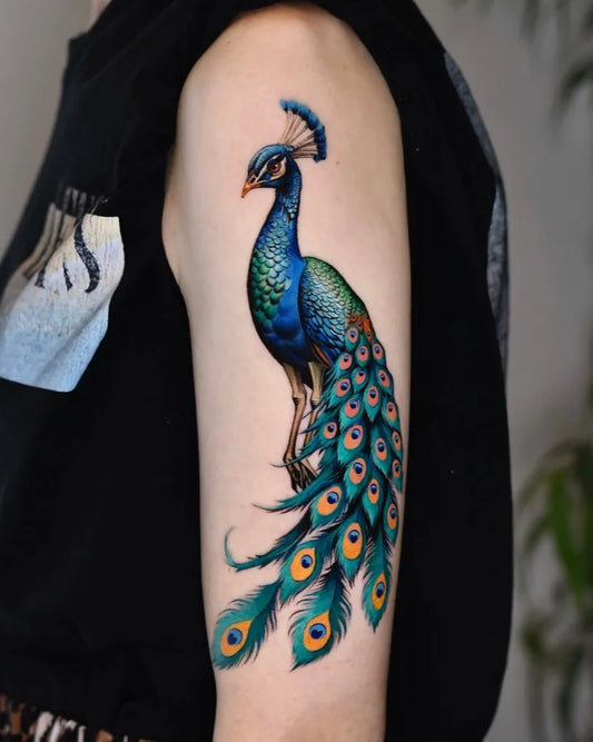 Big Realism Peacock Tattoo on Women Arm by @dm.tatts