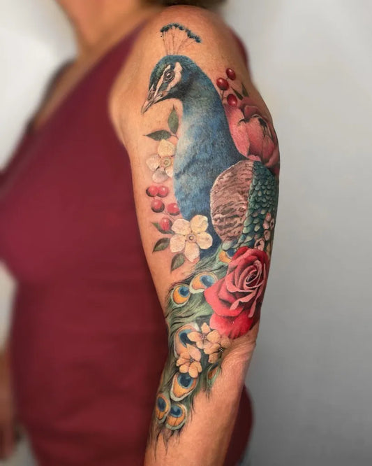 Big Realism Peacock and Roses Tattoo on Women Arm by @kiratattooist