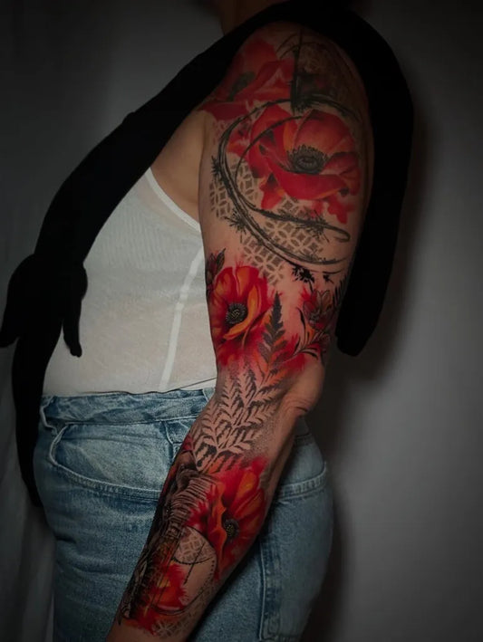 Big Realism Poppy and Fern Tattoo on Women Arm by @seth_darko_tattooer